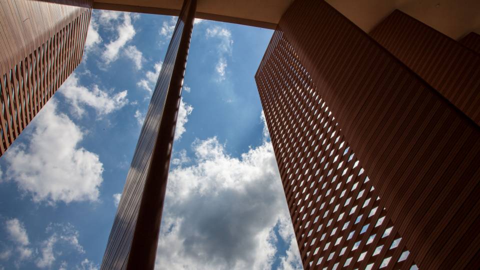 Slats with cloudy blue sky behind them