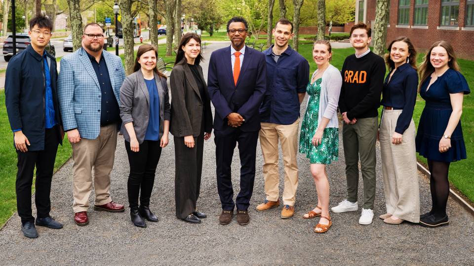 Graduate students honored for their distinguished teaching pose with Dean of the Graduate School Rodney D. Priestley
