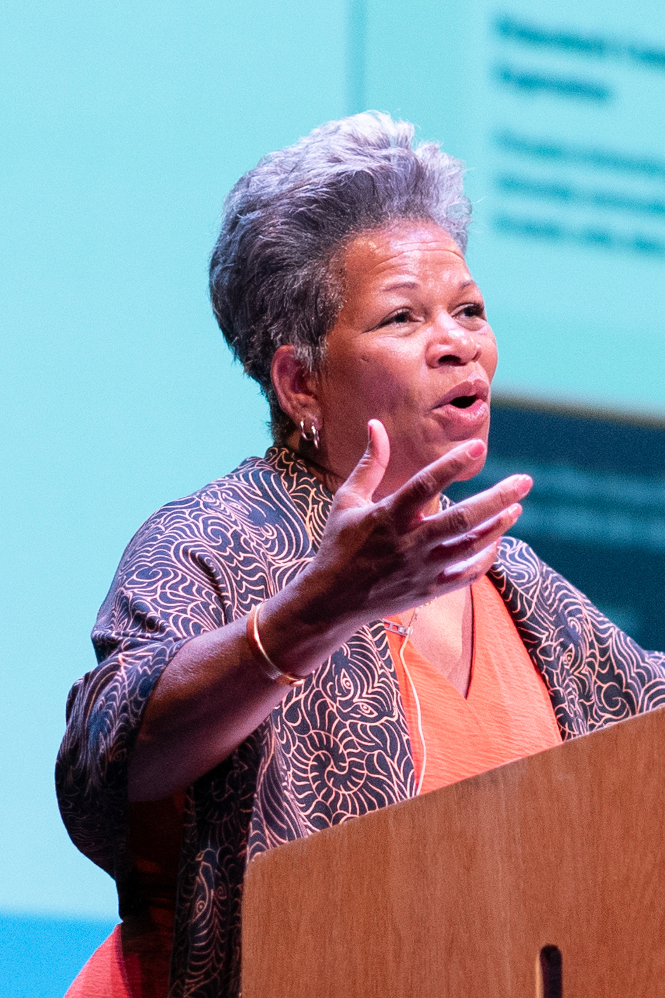 Rochelle Calhoun standing at the podium on the Matthews Stage of McCarter Theatre