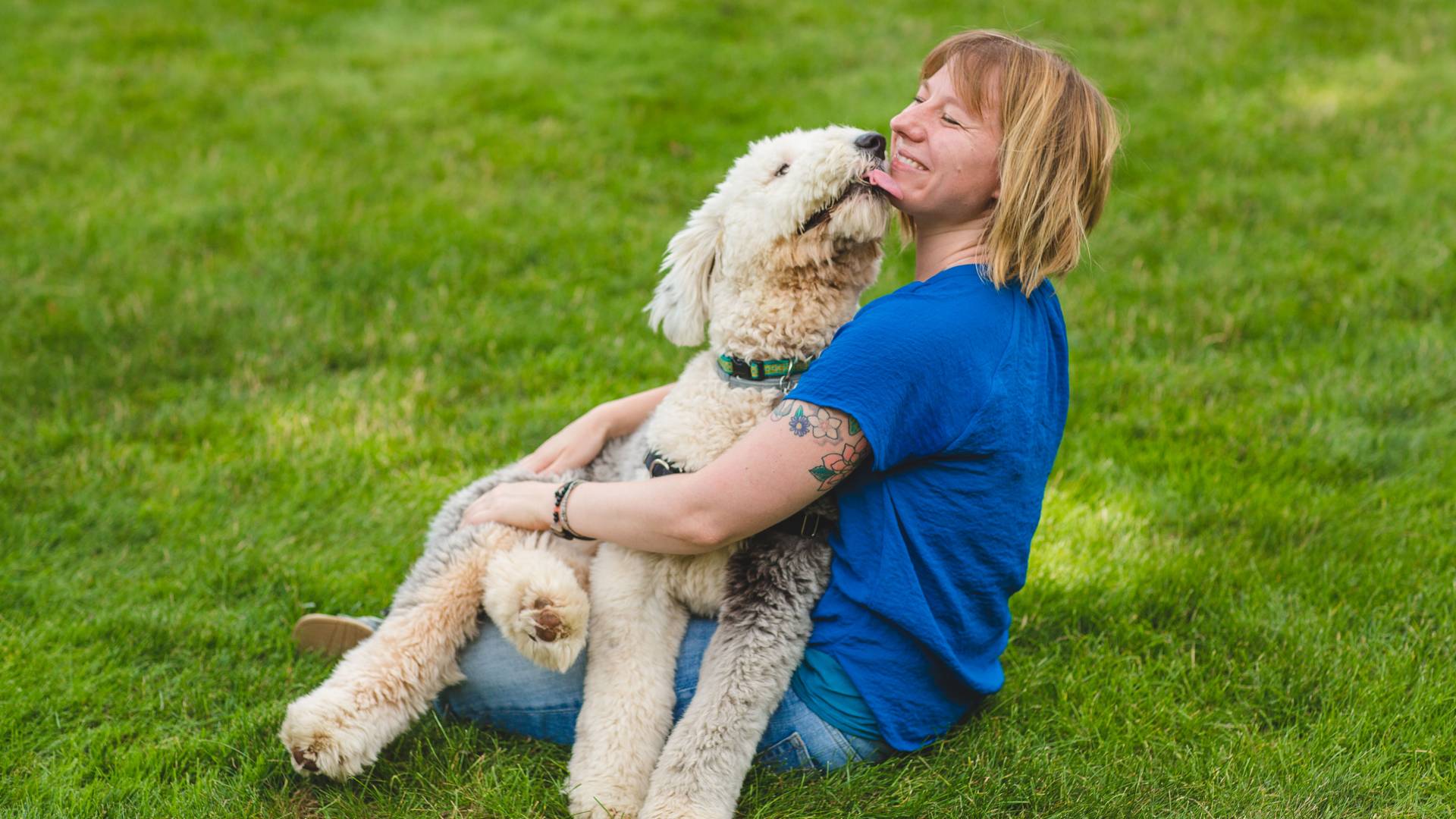 Bridgett vonHoldt sitting with her dog on her lap