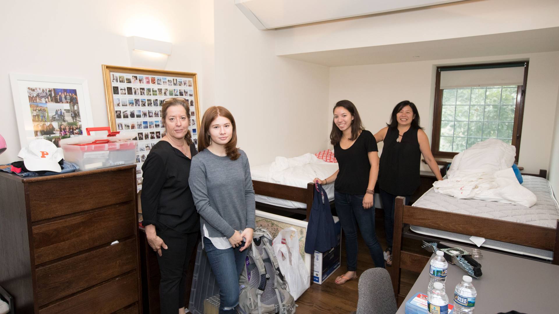 Students moving into dorm room