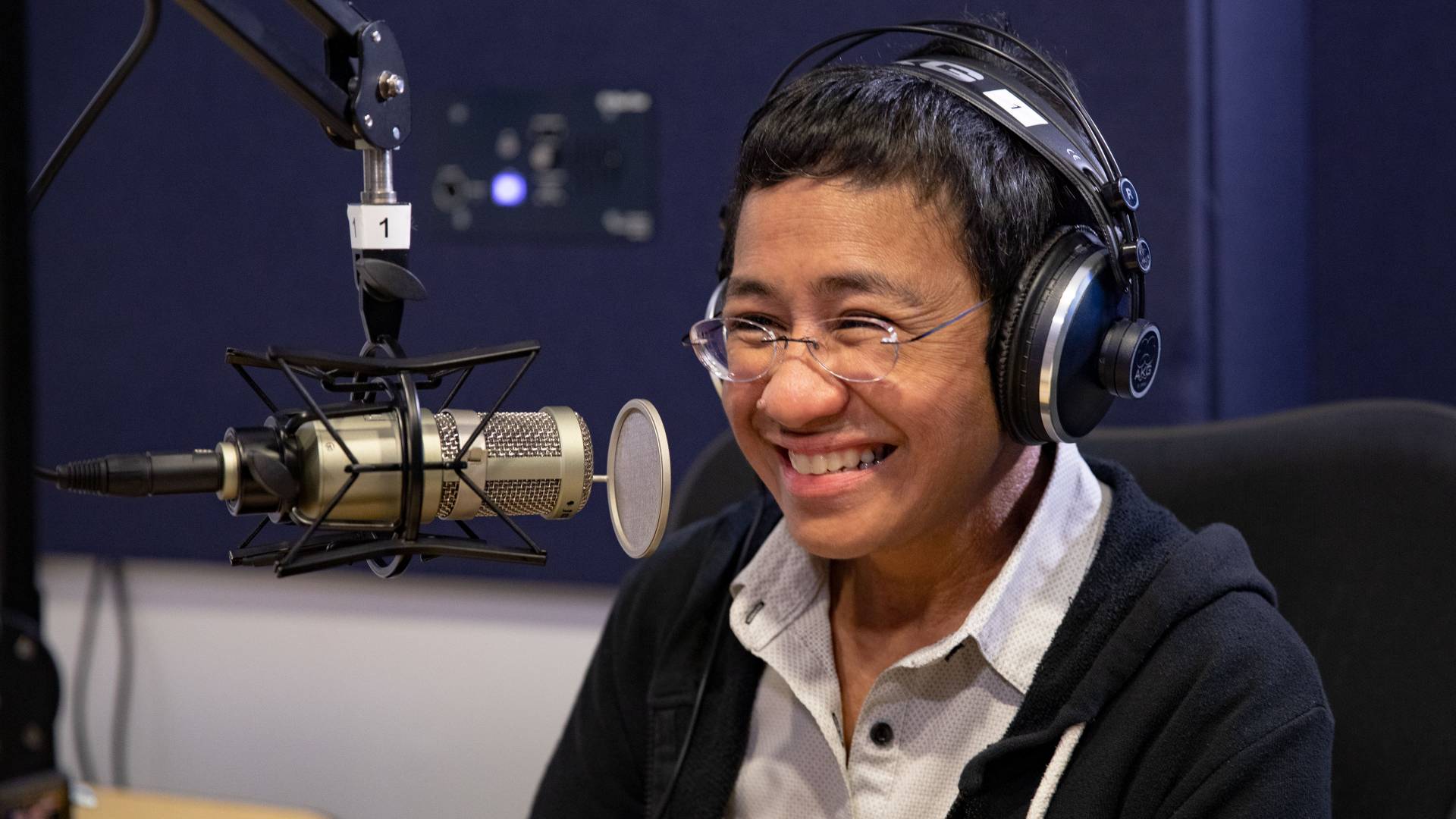 Maria Ressa in a recording booth