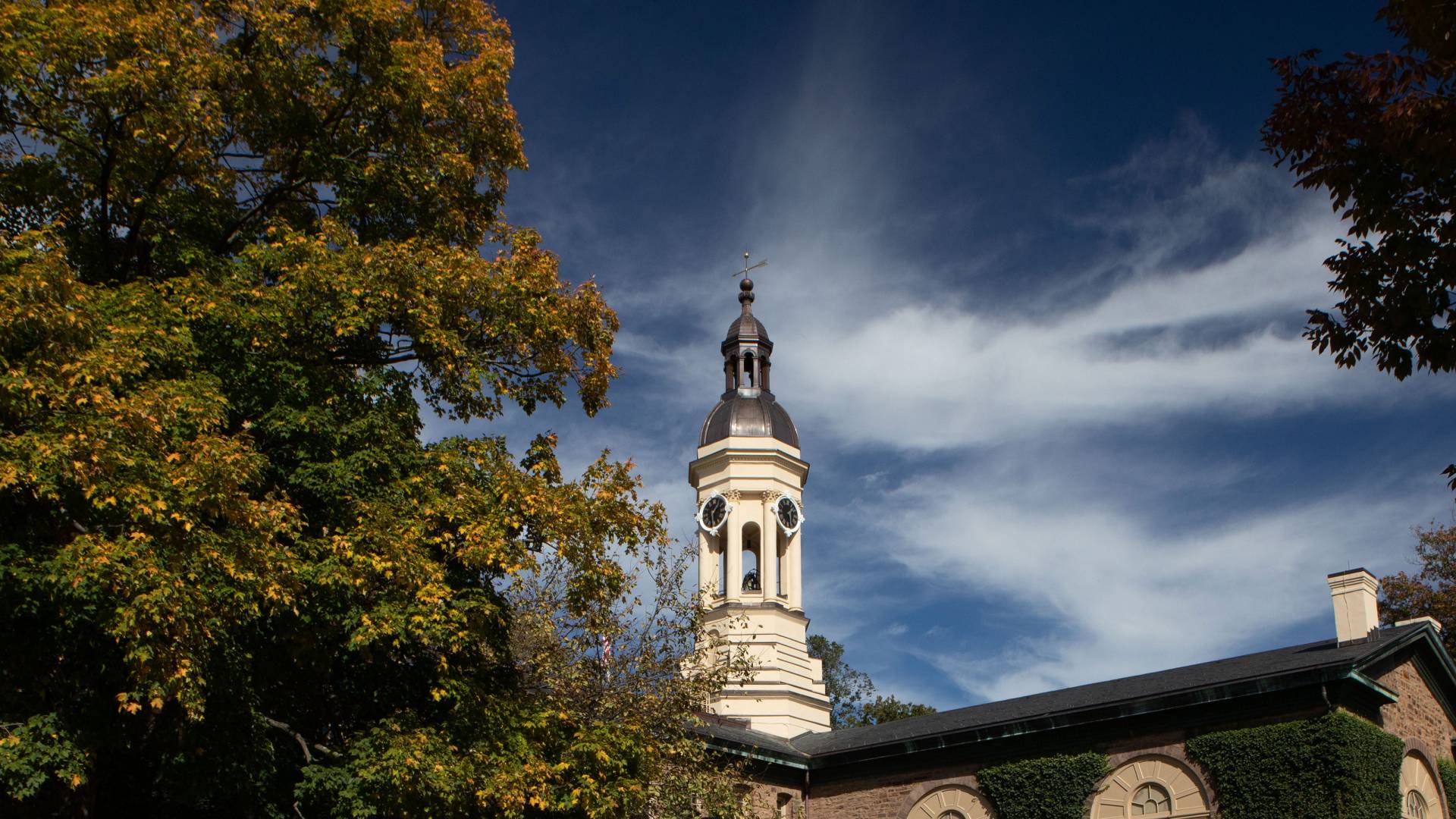 Nassau Hall with white clouds and blue sky behind
