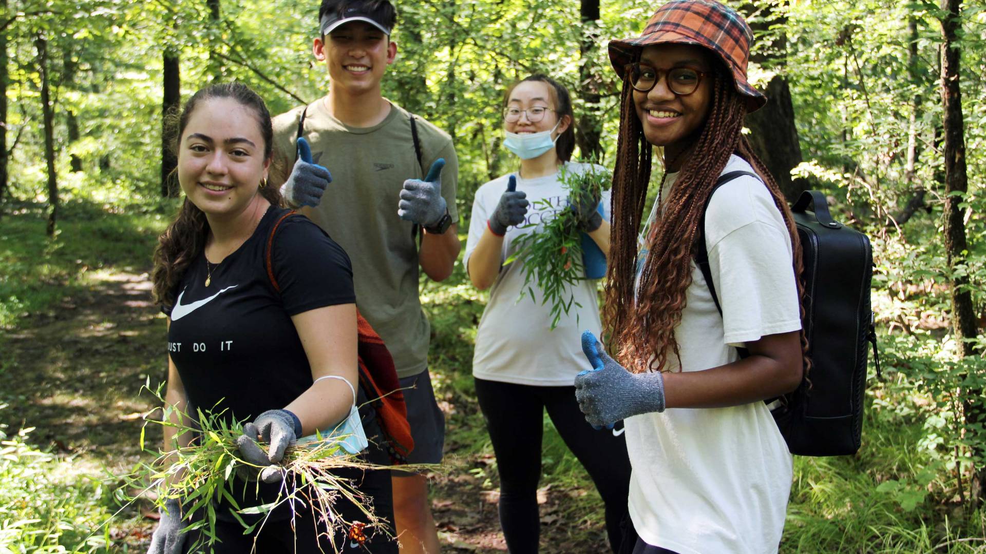 4 students in the woods