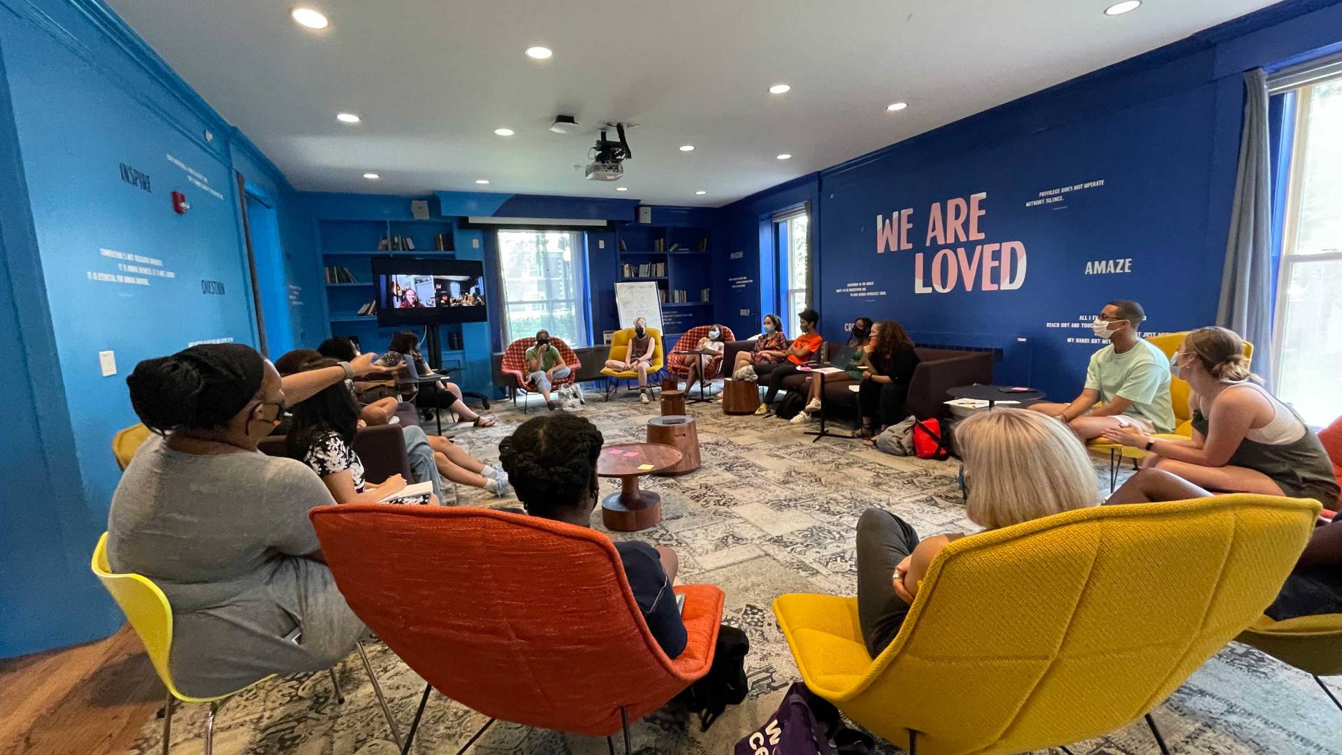 Students sit in a circle to discuss