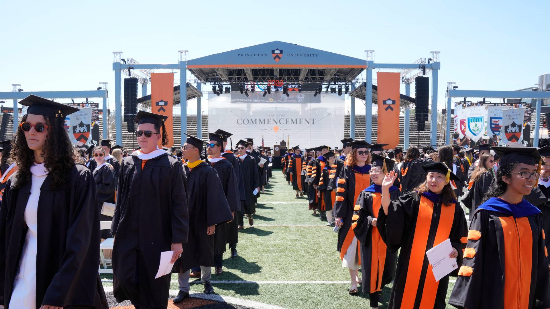 Graduating students in front of the stage