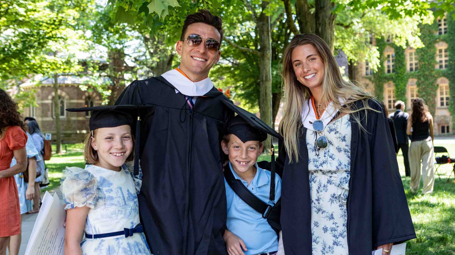 graduating student with his family