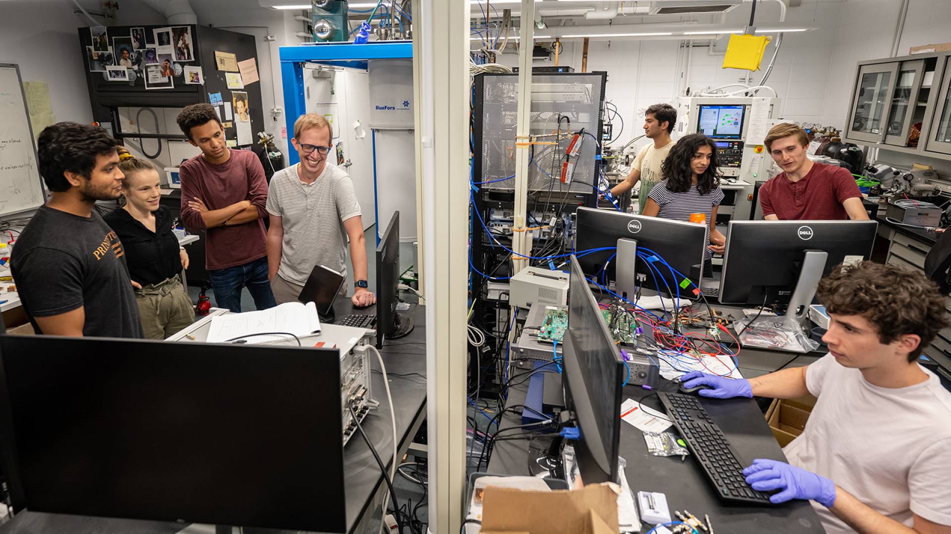 Andrew Houck with students in lab