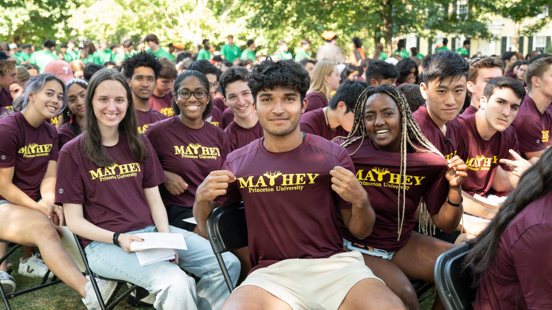 Students show off their residential college t-shirts
