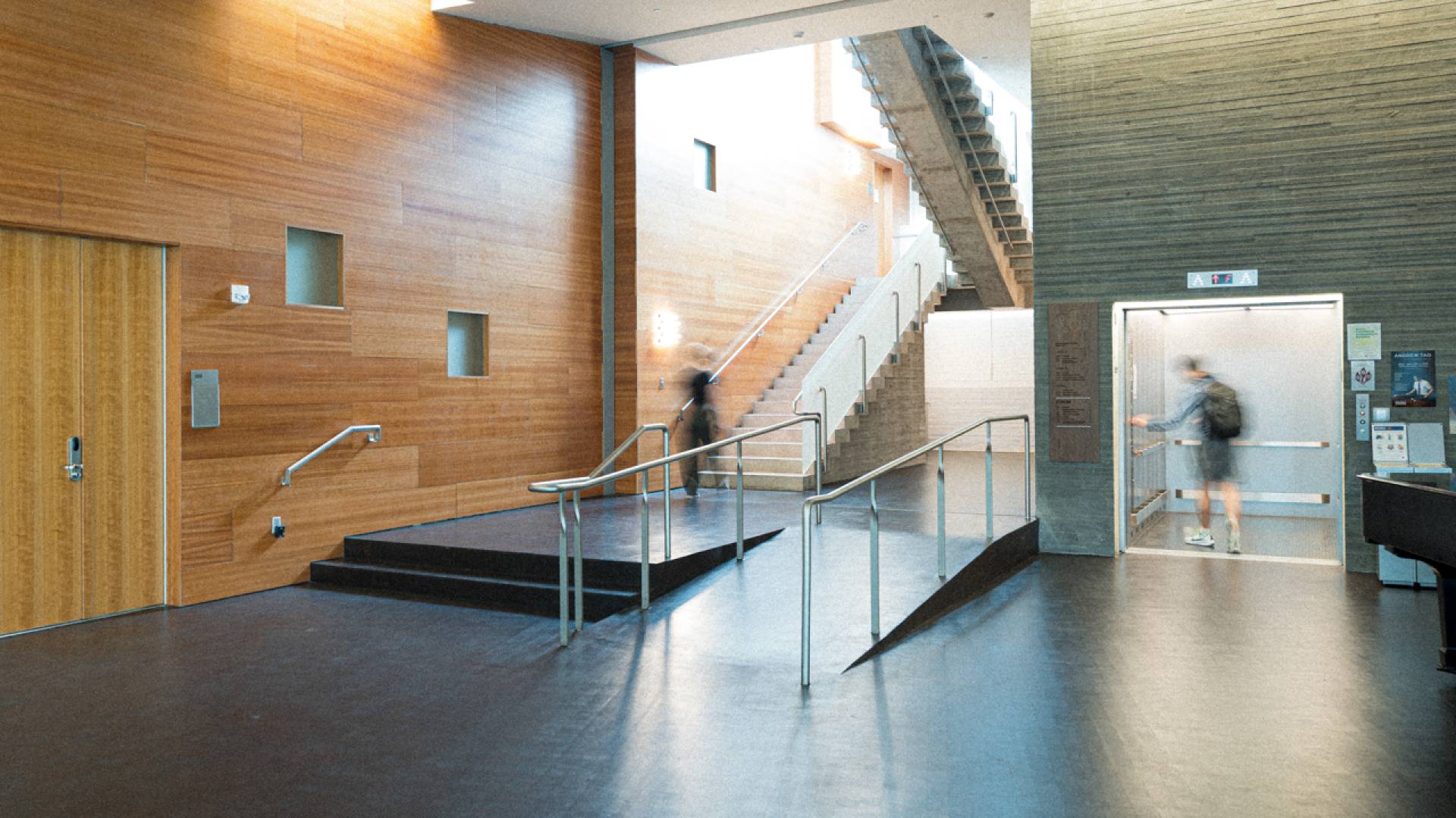 Interior stairs next to an elevator