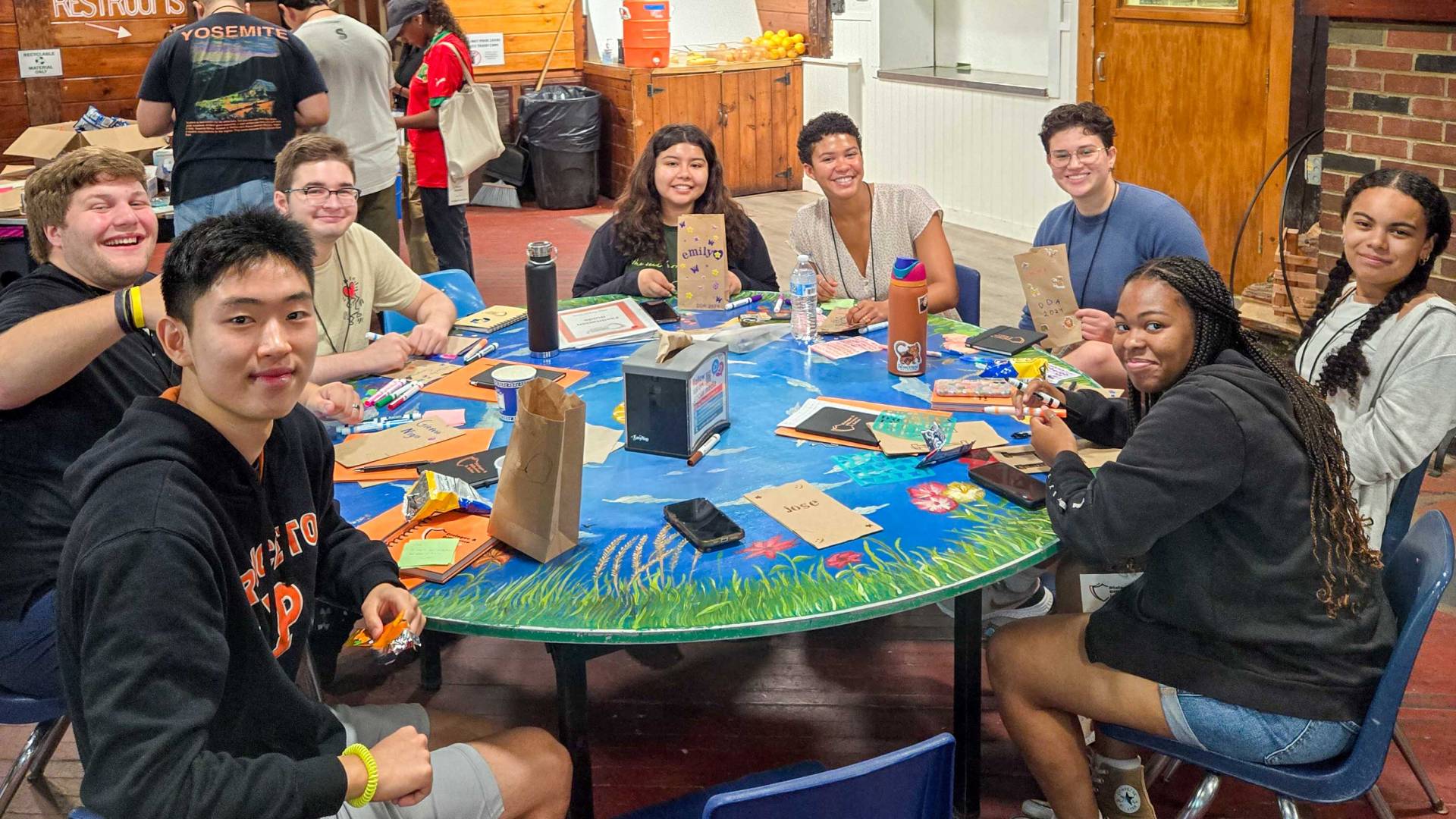 New undergrads meet and discuss around a table