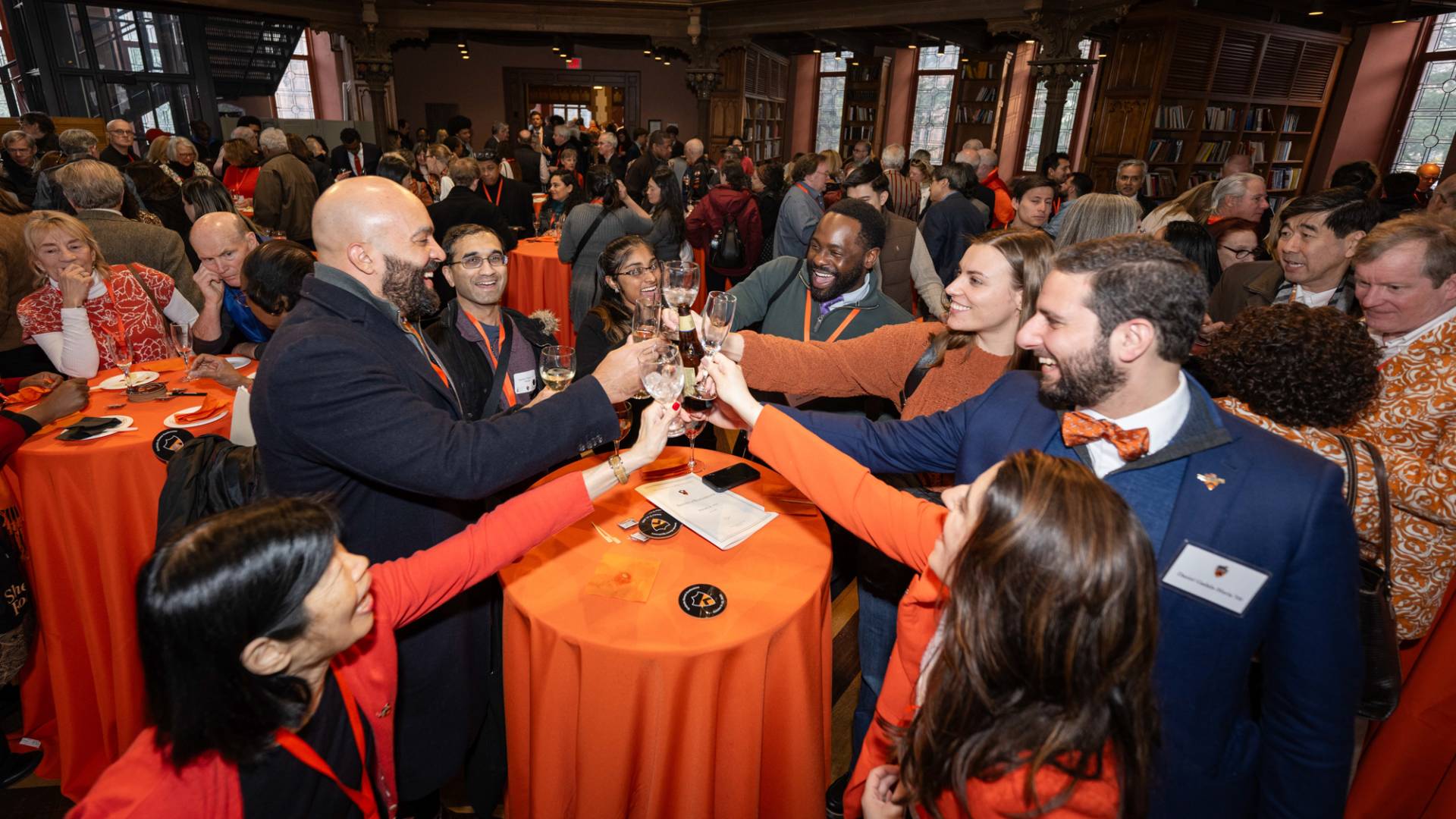 A group of people raising their glass for a toast
