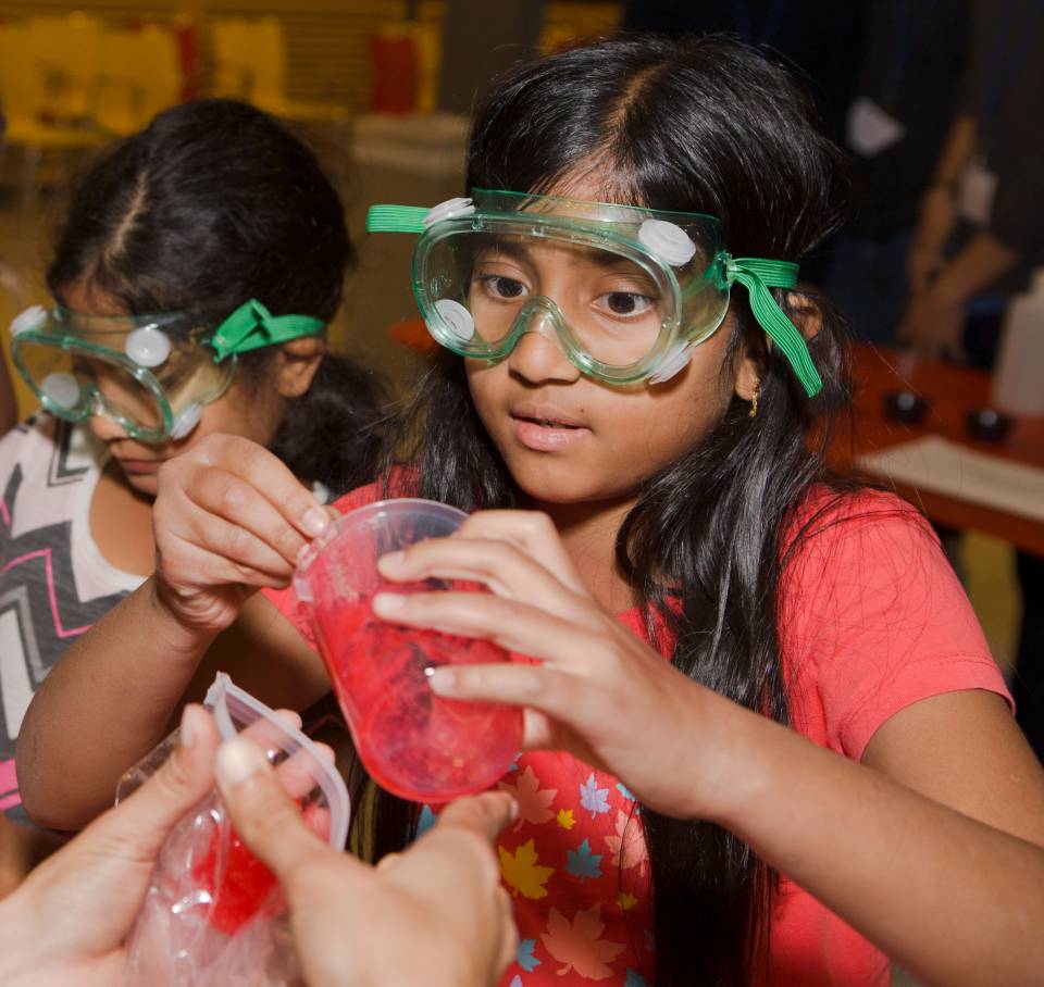 Children making slime at Chemistry Rocks event