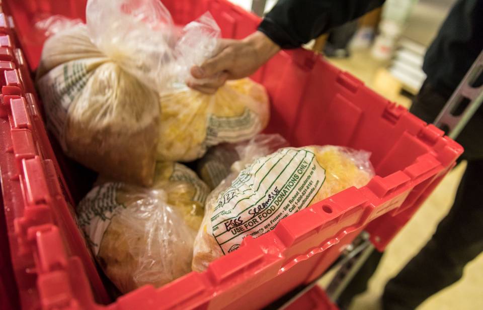Bags of frozen food in red bucket