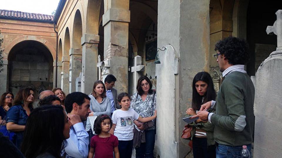Enrico Sassoni, a visiting postdoctoral research associates in Princeton's Department of Civil and Environmental Engineering, is working to preserve monuments, like those at Italy's Certosa di Bologna cemetery, from environmental degradation. Above, Sossoni, right, leads a tour of the cemetery.