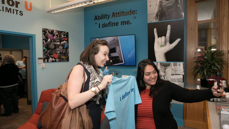 AccessAbility Center posing for selfies at opening of center