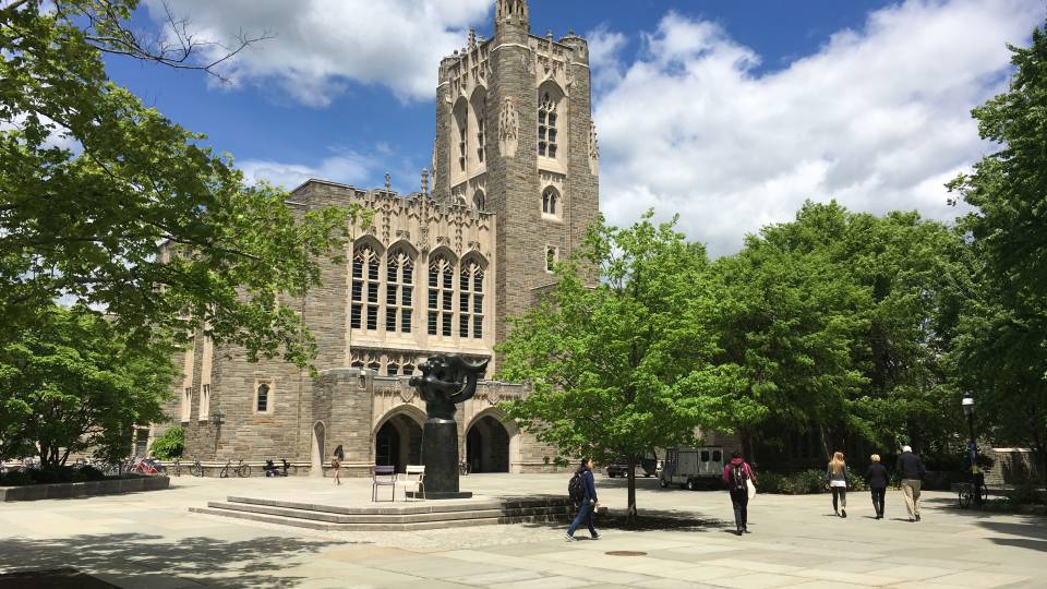 Students walking Firestone Library Plaza