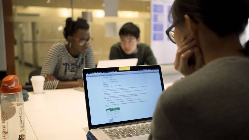 Students looking at their laptop screens