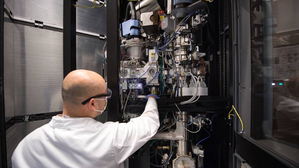 Paul Shao, imaging and analysis specialist, adjusts Princeton's cryo-electron microscope