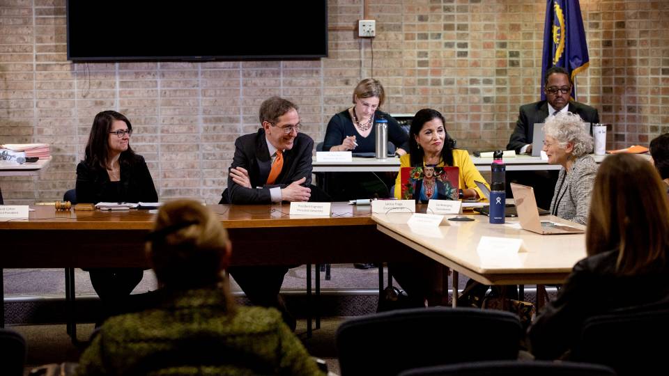 Lempert, Eisgruber sit at the head of the table at a town council meeting