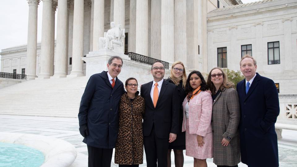 Eisgruber, Romero, Sanchez, Smith, and legal team pose in front of the Supreme Court building