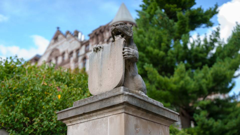 Tiger statue holding the Princeton shield