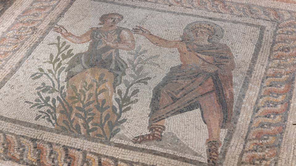 Closeup of a museum mosaic depicting Apollo and Daphne.
