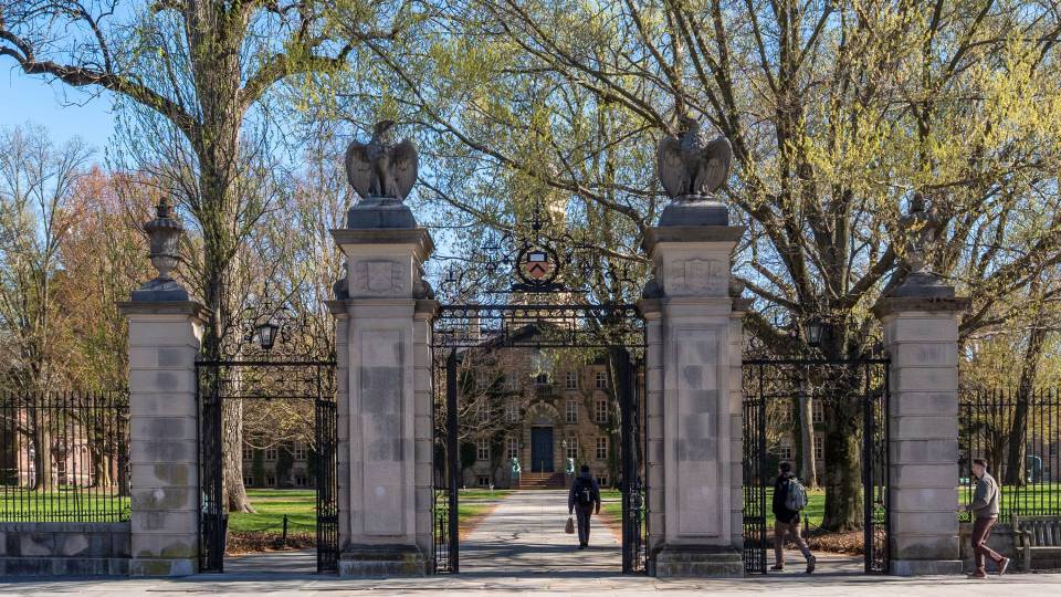 FitzRandolph Gate stands at the entrance of Princeton University's campus on a bucolic spring day