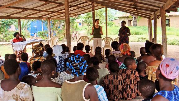 Nalule explaining how to use bed nets