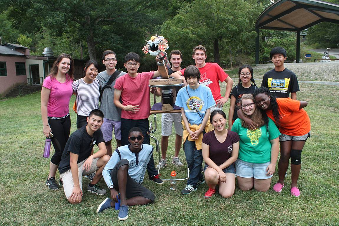 Students who explored service and sustainability at the Pocono Environmental Education Center during Community Action pose with the winning "TigerScope" recycled art project