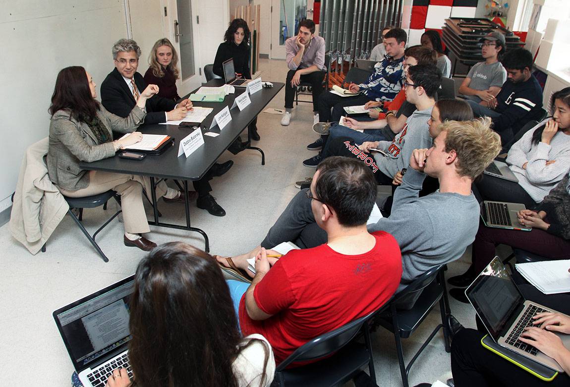 Students in the class pepper a panel of experts with questions on their assigned topic of identity crises.