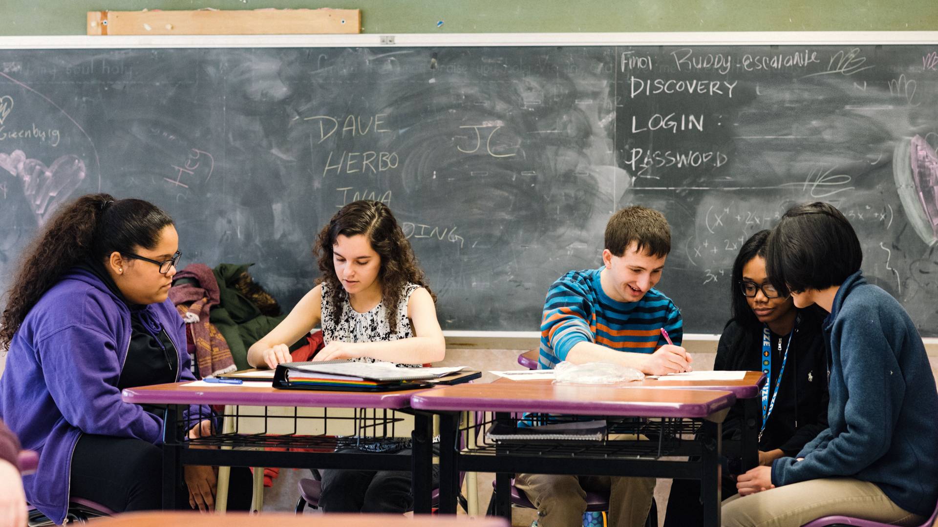 Students tutoring high school students in math