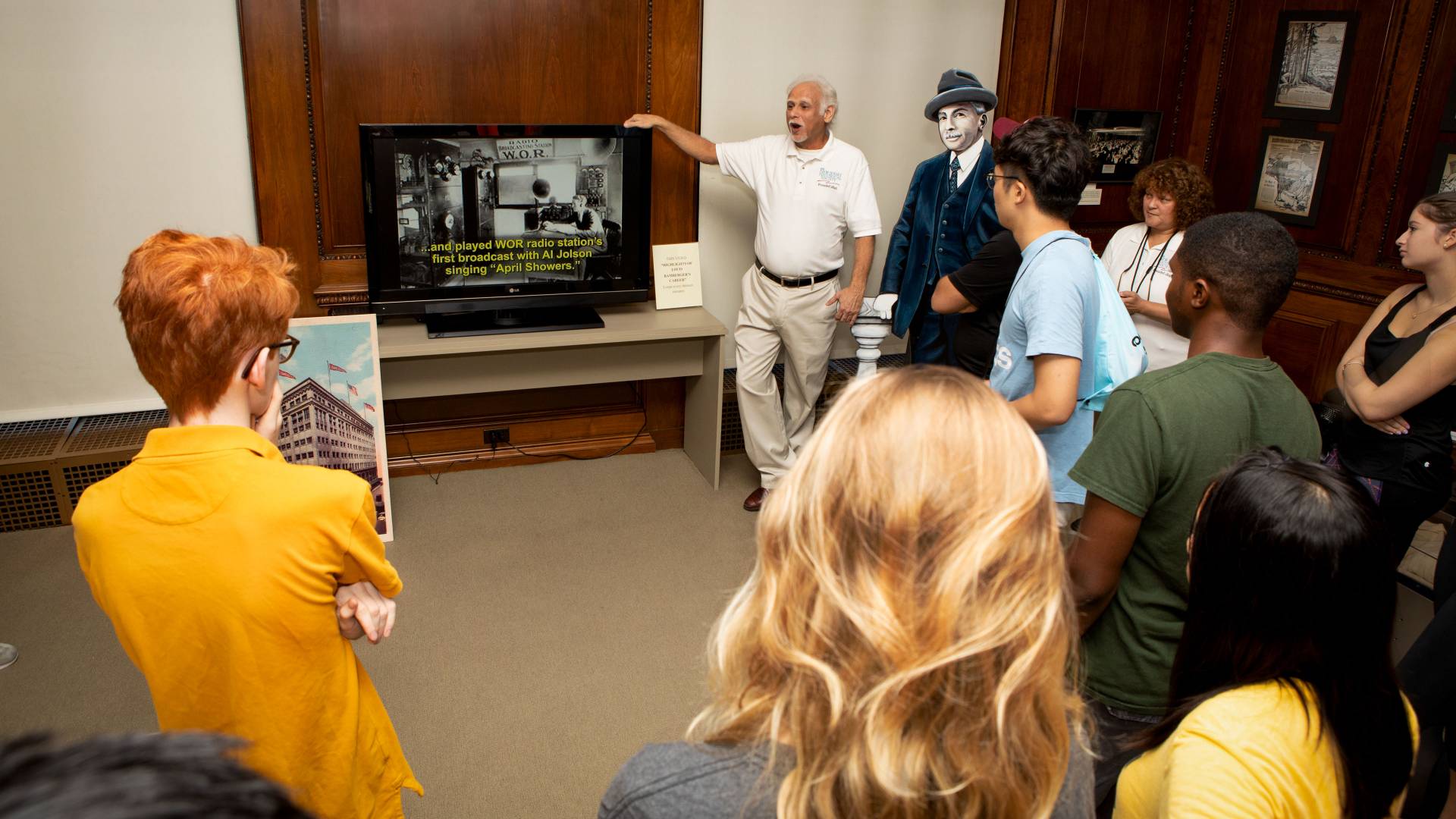 NJ Historical Society director Steve Tettamanti speaking to students at exhibit on Louis Bamberger