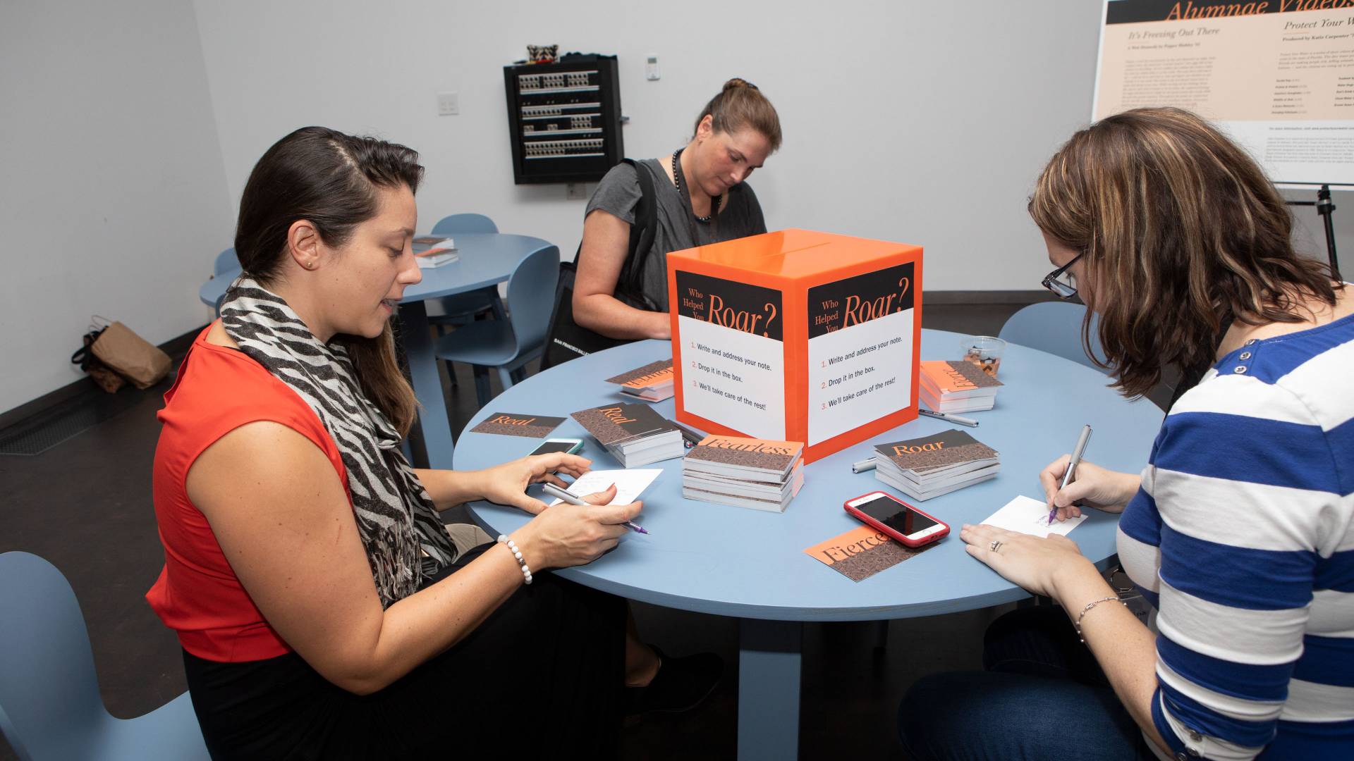 Alumnae writing postcards