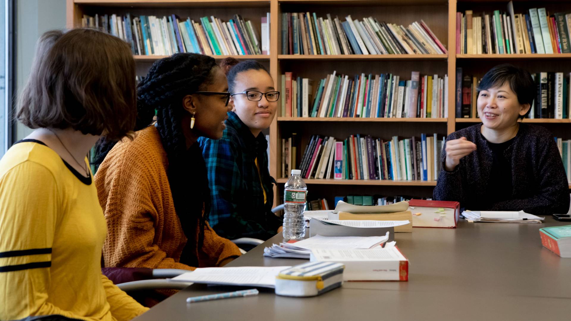 Yiyun Li engaging with three students in creative writing class