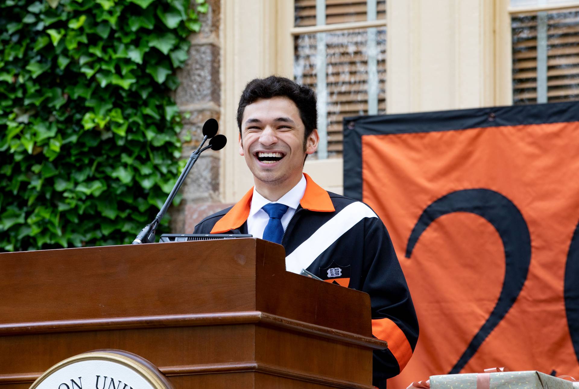 Chris Umanzor speaks at the podium