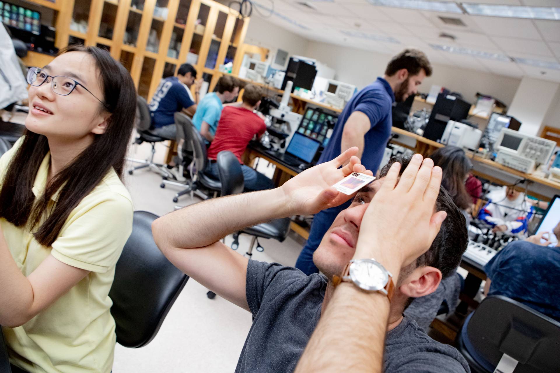 Two students work on a science project