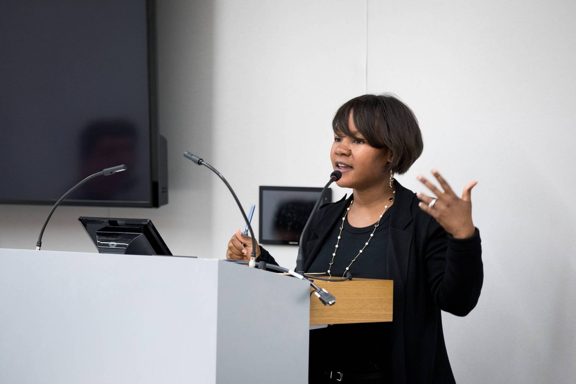 Renita Miller speaking at podium