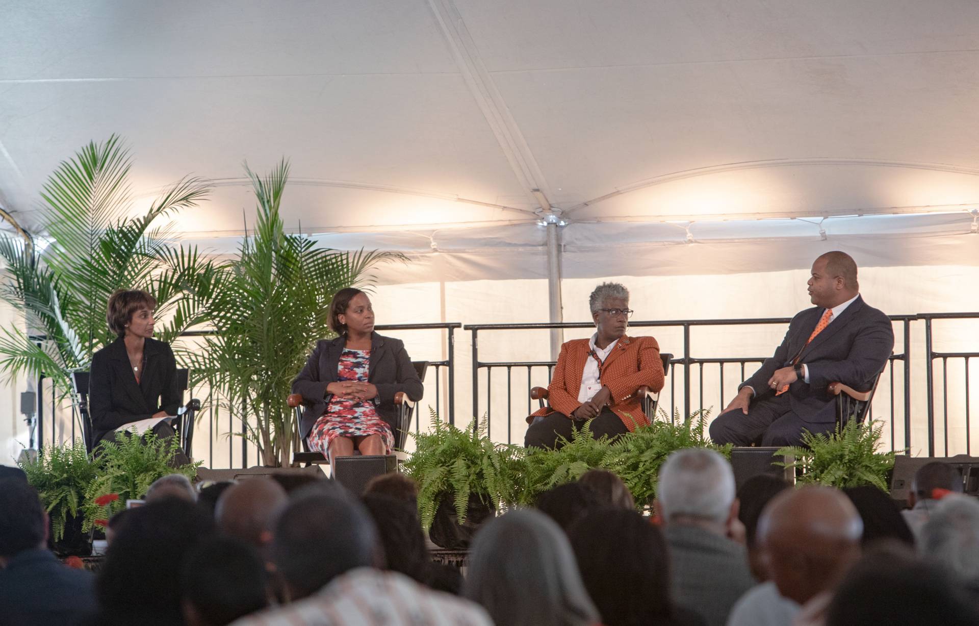 Panelists sitting on stage