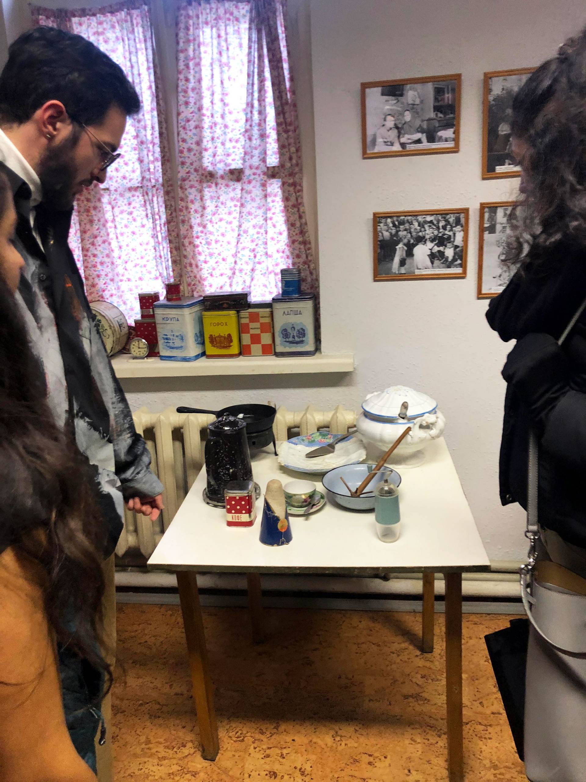 Students standing in communal apartment kitchen