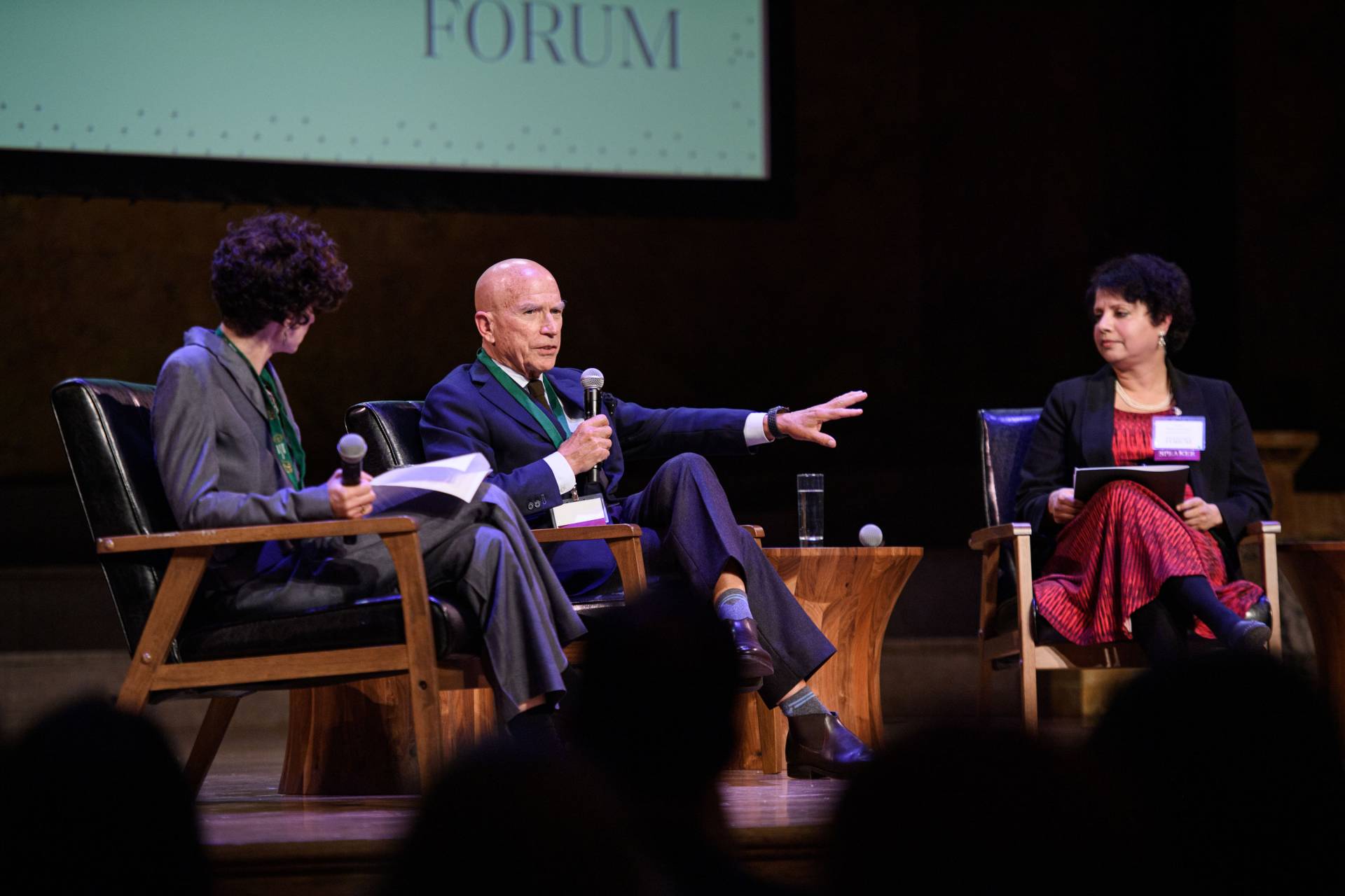 Ferenbach gesticulates while speaking at the PEI event