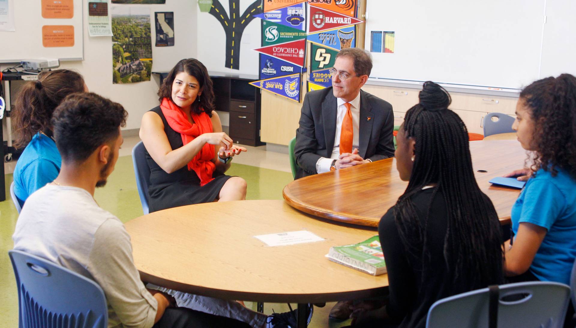 Gonzales gesticulates as she speaks to a group