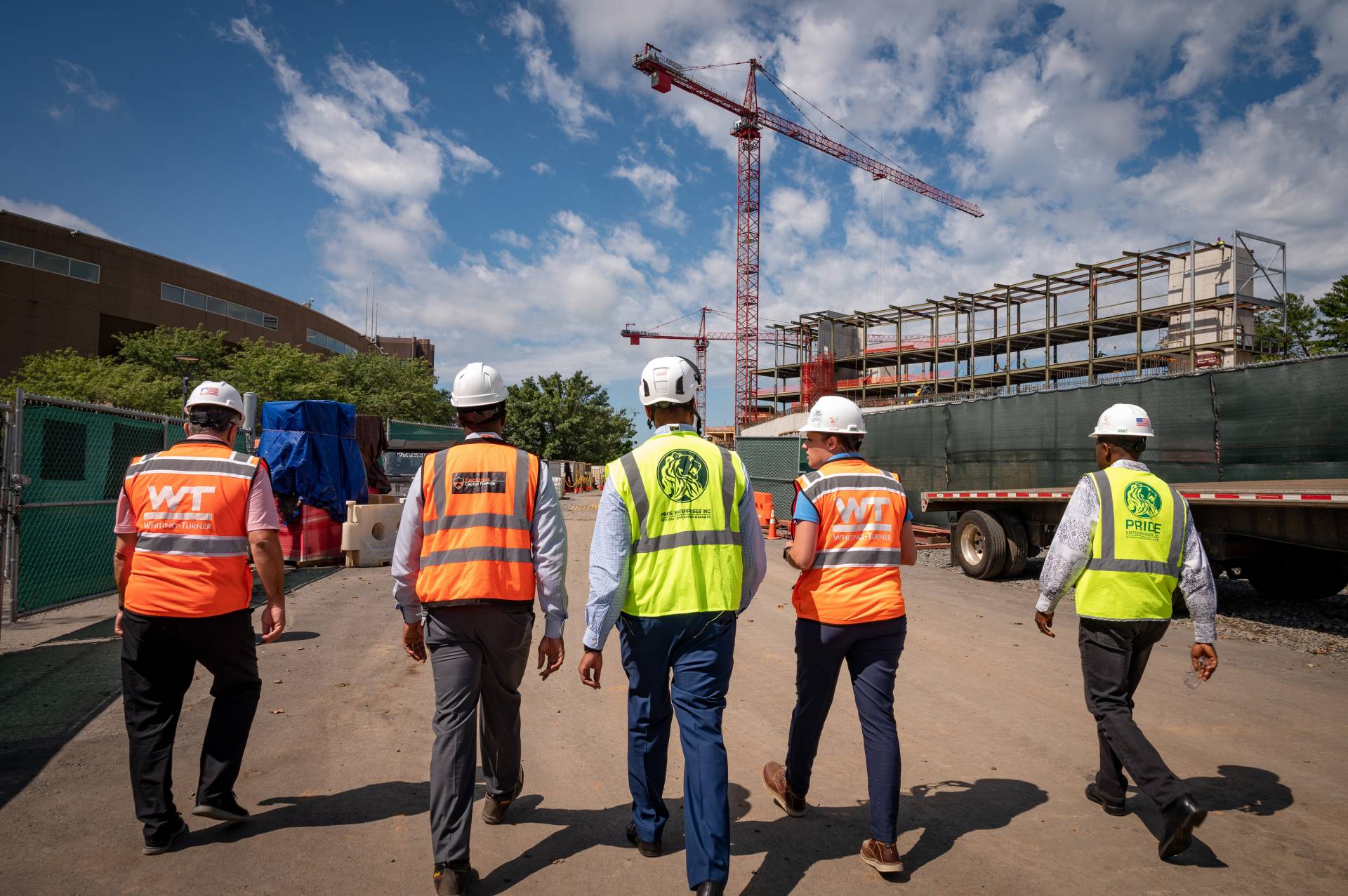 Workers wearing high-vis vests and hard hats at the SEAS Construction Site