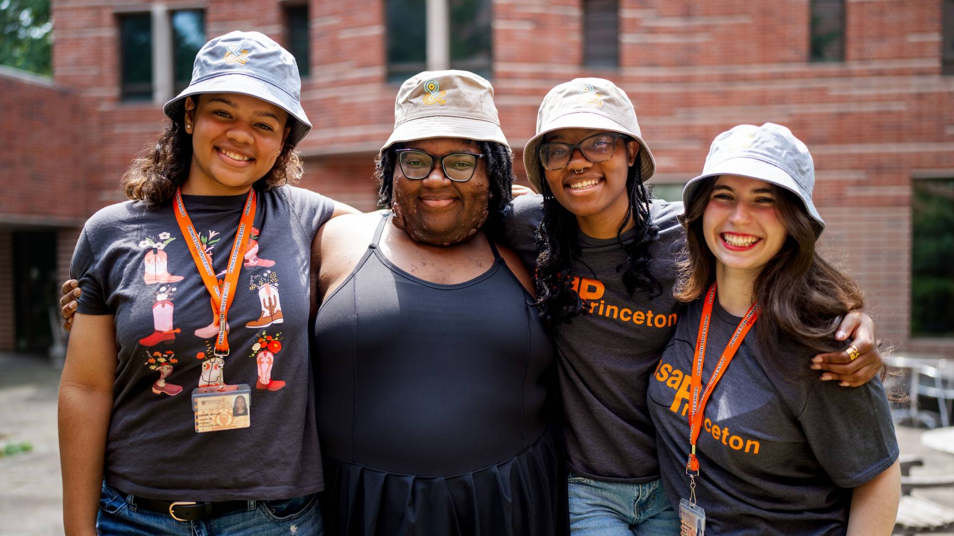 Four students pose for a photo