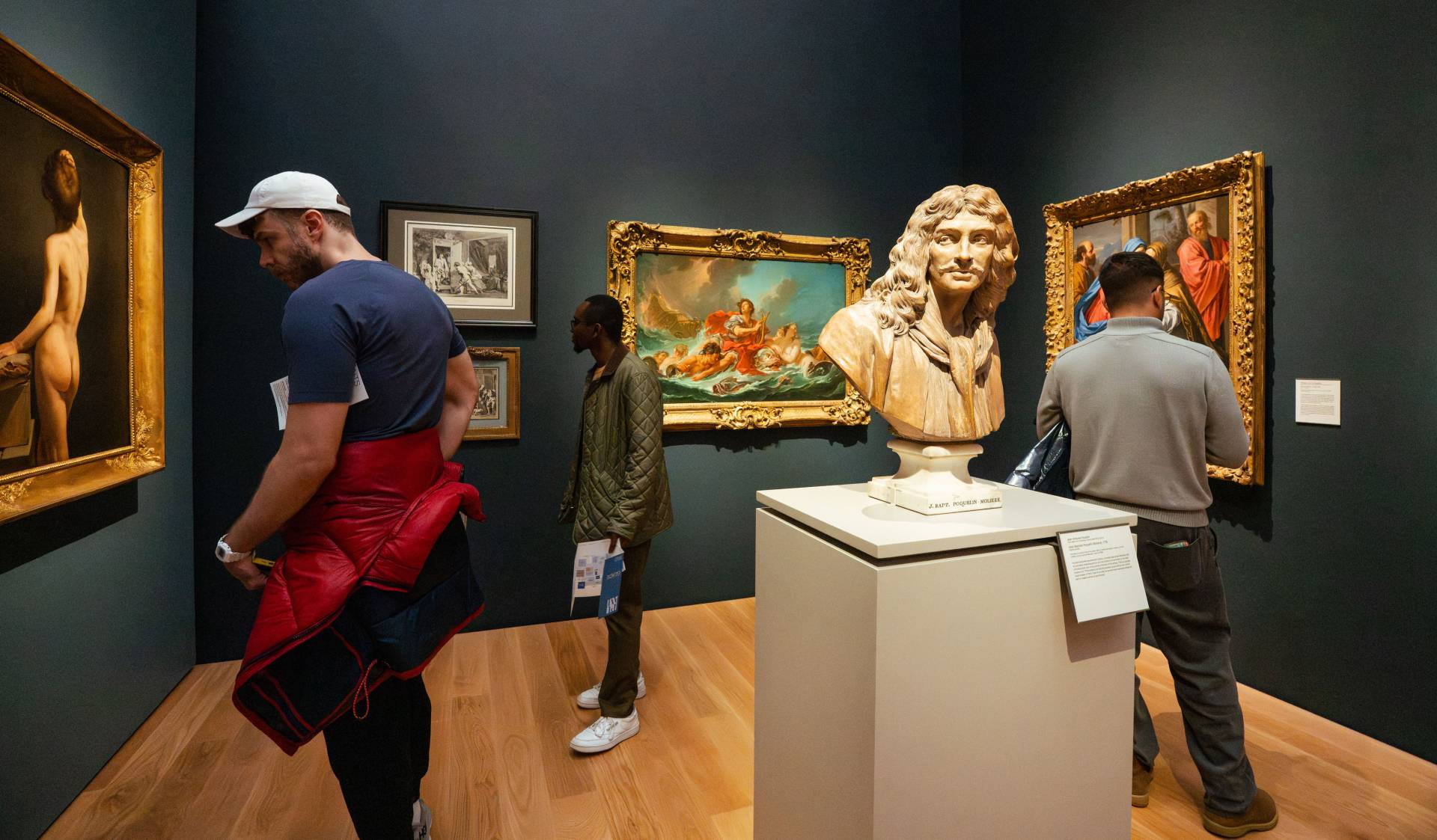 University faculty and staff visit the art museum during a special preview before the official opening.