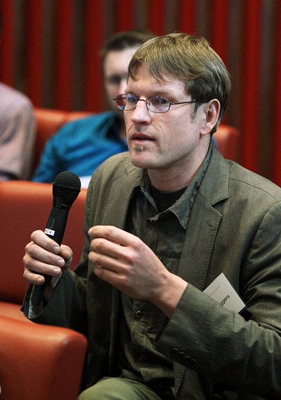 Forrest Meggers, assistant professor of architecture and the Andlinger Center, asks a question during the panel.