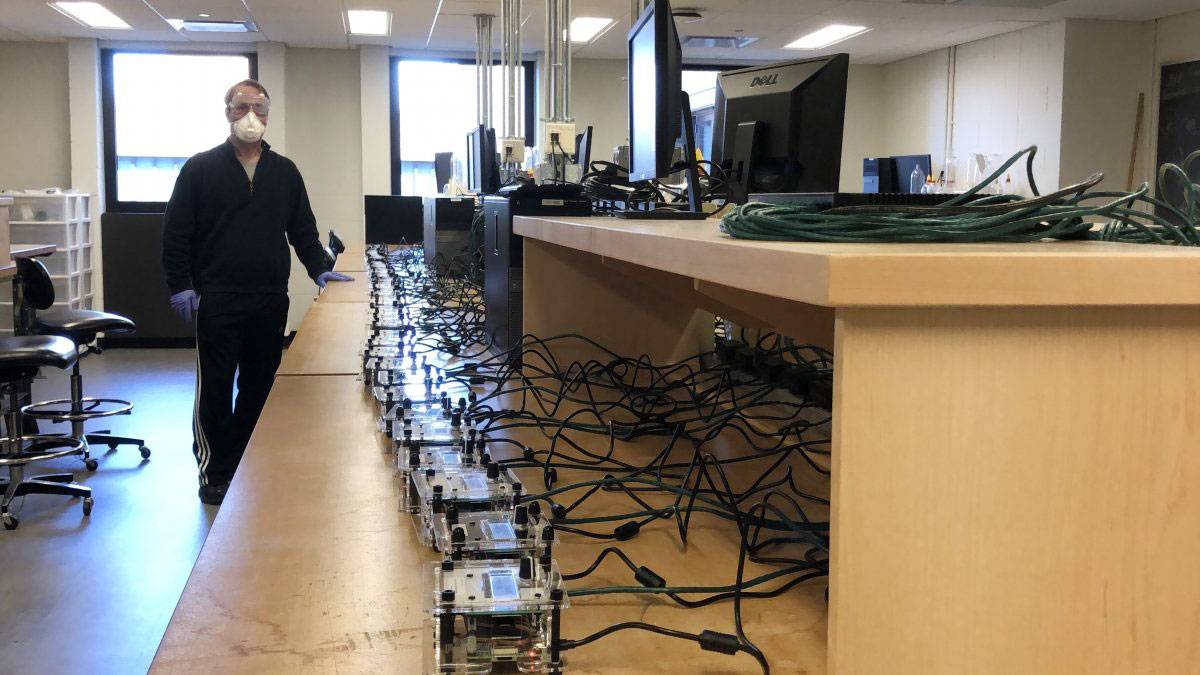 A professor and a row of machines