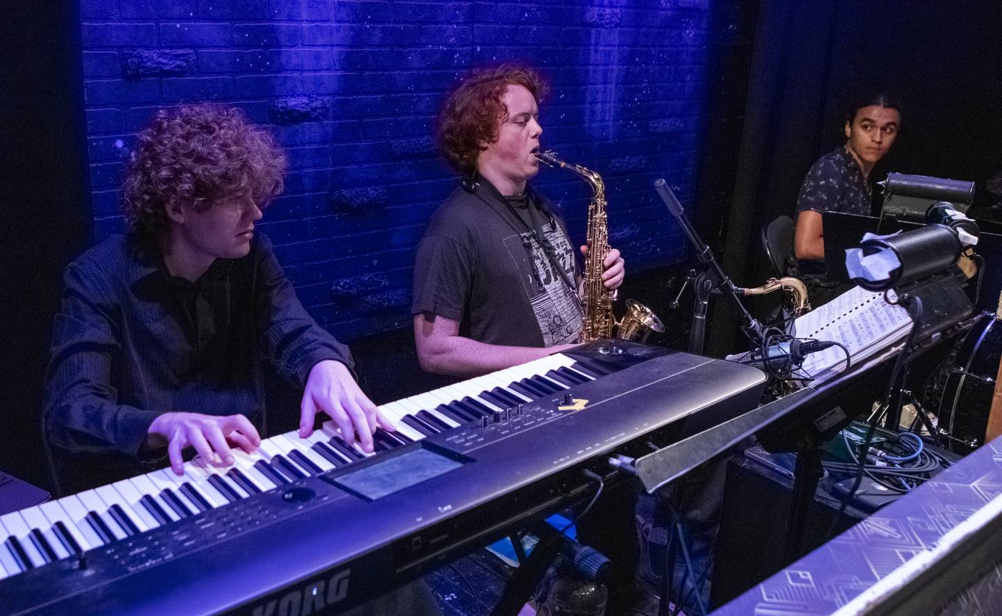 Ned Furlong '22, music director, on keyboard; Henry Raker on woodwinds and Paolo Montoya '25 on drums.