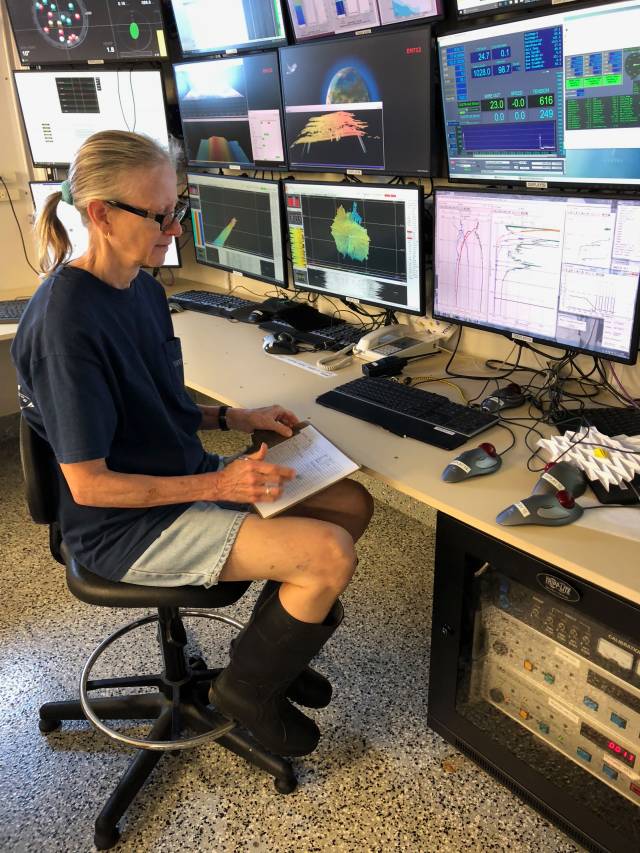 Bess Ward analyzing data on ship