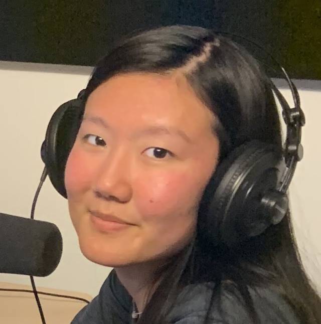 Susan Baek ’23 at the microphone